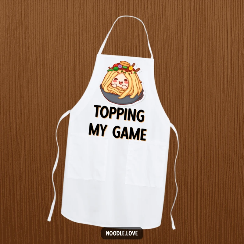 Funny kitchen apron showing a happy noodle character blissfully burrowing into an enormous, tempting pile of various delicious food toppings.