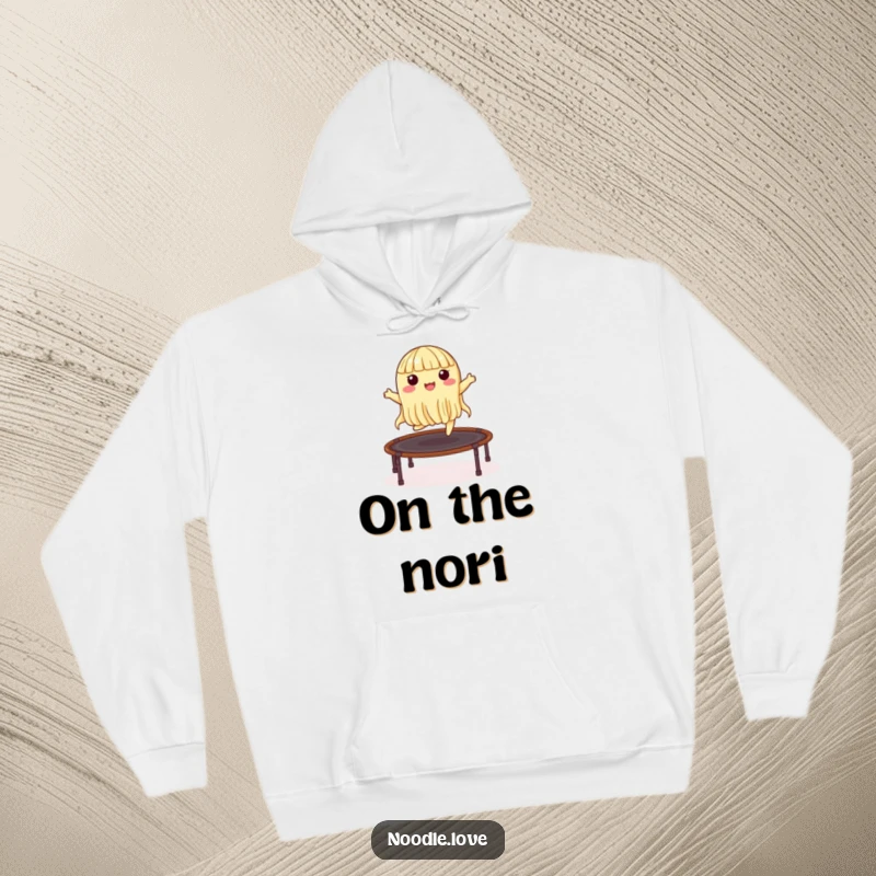 Funny hoodie showing an energetic noodle character joyfully bouncing on a nori trampoline, perfect for cozy and humorous wear.