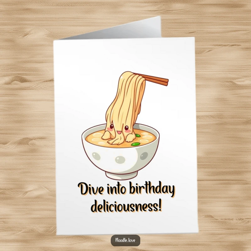 Funny Free Printable Birthday Card: Noodle character dramatically dives headfirst into a bowl of broth, celebrating with gusto, a unique printable gift.